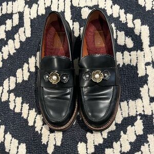 Coach Black Loafers with Gold Floral Accent